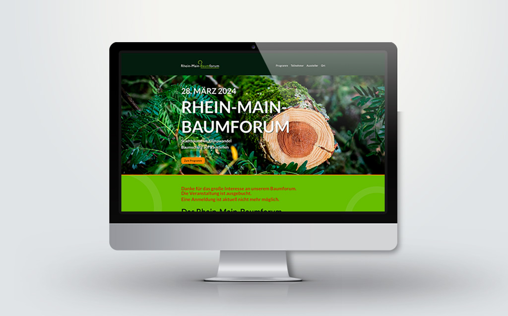 Monitor mit einem Ausschnitt der Webseite des Rhein-Main-Baumforums 2024.